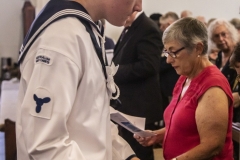 An Australian Naval Cadet makes the collection in the traditional way.